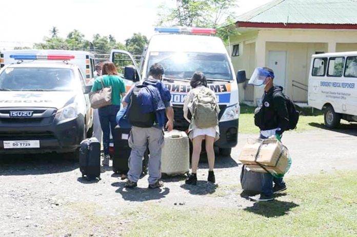 Antiqueño repatriates are being fetched by an ambulance from their respective local government units in Antique Airport. The coming home of Antiqueños was made possible through the "Libre Uli Antique" program, a joint undertaking of Gov. Rhodora Cadiao and Lone District Rep. Loren Legarda. CONTRIUBTED PHOTO