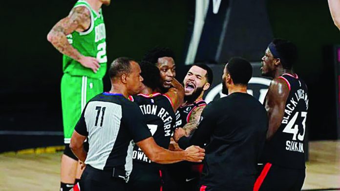 Toronto Raptors’ Ogugua Anunoby was mobbed by his teammates after draining a game-winning triple at the buzzer. AP