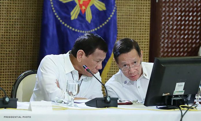 During his public address on Monday, President Rodrigo Duterte once again defended Health Secretary Francisco Duque III despite Senate recommendation of filing of criminal charges over the alleged “improper and illegal implementation” of the state insurer’s Interim Reimbursement Mechanism, “malversation of public funds” and violation of the Anti-Graft and Corrupt Practices Act. PRESIDENTIAL PHOTO