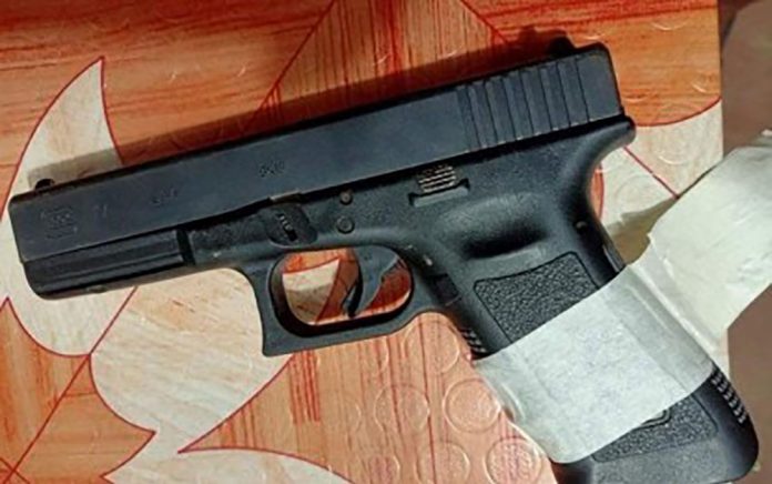 RECOVERED The Glock pistol issued to the late police chief of Guihulngan City, Negros Oriental, Superintendent Arnel Arpon, was recovered from a suspected New People’s Army leader who was arrested in a joint military and police operation on Sept. 20.