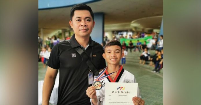 Cyd Edryc Esmaña (right) led the campaign of head coach Denmark Pinggol with two golds from both regular and elite rounds of the cadet blackbelt male category. PHOTO COURTESY OF MARK PINGGOL