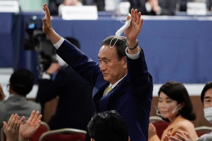 Japan’s Chief Cabinet Secretary Yoshihide Suga reacts after being elected as new head of Japanís ruling Liberal Democratic Party at the party’s leadership election in Tokyo on Sept. 14, 2020. EUGENE HOSHIKO, AFP/POOL