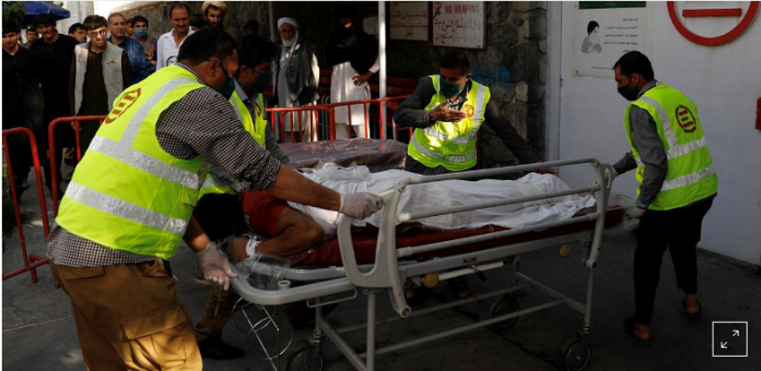 Afghan men carry an injured to a hospital after a blast in Kabul, Afghanistan on Wednesday, Sept. 9, 2020. MOHAMMAD ISMAIL/REUTERS