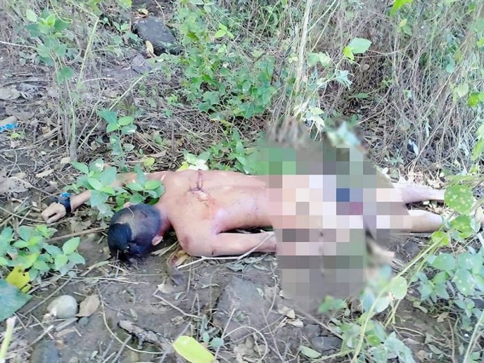 Construction worker Gerel Laudato lies lifeless in a grassy portion near their bunkhouse in Barangay Bongsod, Sibalom, Antique around 6:25 a.m. on Oct. 1. STEPHEN LOUIE CHECA/PN