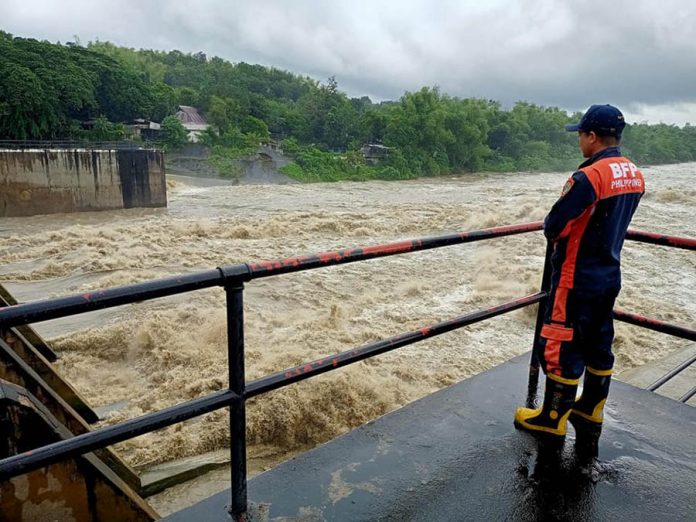 Personnel of the Bureau of Fire Protection monitors the Jalaur Diversion Irrigation Dam in Barangay Moroboro, Dingle, Iloilo on Monday, Oct. 26, 2020. The dam’s water level rose due to rainfall dumped by Typhoon “Quinta". BFP-DINGLE