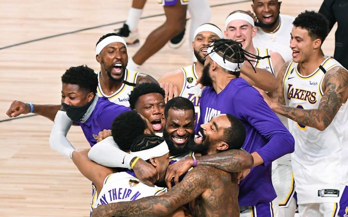 Los Angeles Lakers celebrate their NBA championship after defeating Miami Heat in Game 6 of their NBA Finals in Orlando on Sunday. WALLY SKALIJ / LOS ANGELES TIMES