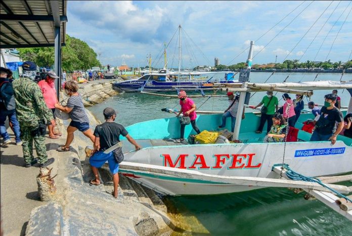 A wooden-hulled motorboat from Guimaras Island docks at the Iloilo Ferry Terminal-Parola Wharf in Iloilo City. Wooden-hulled motorboats plying the Guimaras-Iloilo route and vice versa can still operate until December 2020. IAN PAUL CORDERO/PN