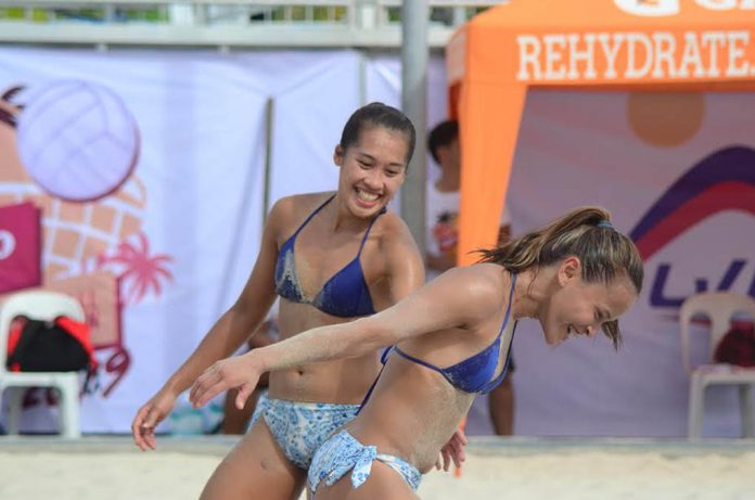 Negrense Bernadeth Pons and Cherry Rondina celebrate during the Philippine Superliga beach volleyball tournament last year. CONTRIBUTED PHOTO