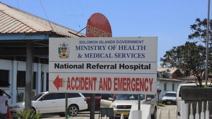 A road sign points the way to emergency services in Solomon Islands. WORLD BANK