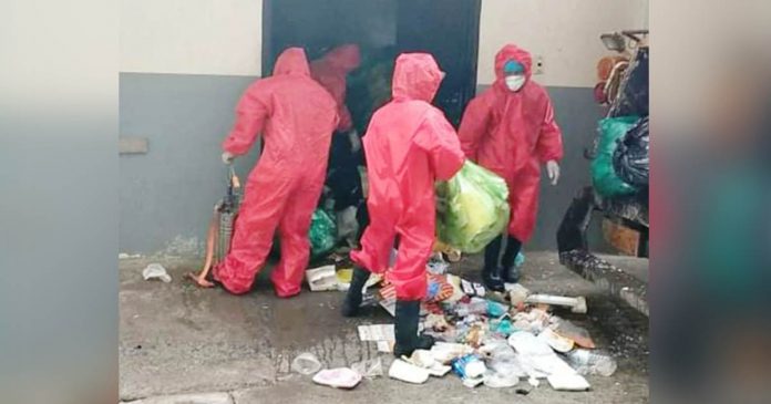 Wearing protective gear, personnel of the Iloilo City government’s General Services Office collect wastes from quarantine facilities in the metropolis. ILOILO CITY PIO