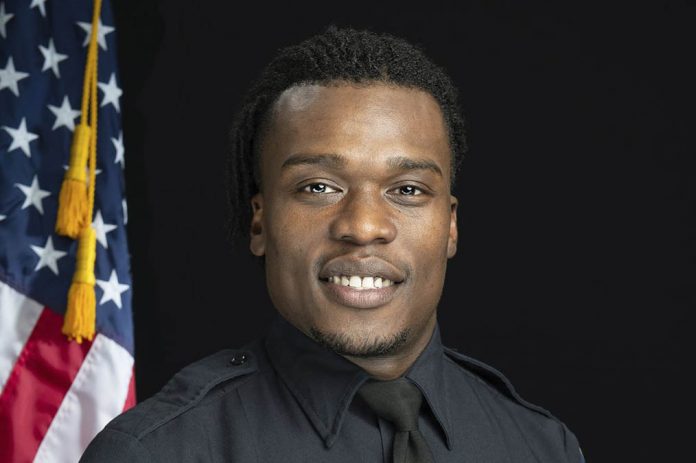 This undated photo provided by the Wauwatosa Police Department in Wauwatosa, Wis., shows Wauwatosa Police Officer Joseph Mensah. GARY MONREAL/MONREAL PHOTOGRAPHY LLC/WAUWATOSA POLICE DEPARTMENT VIA AP