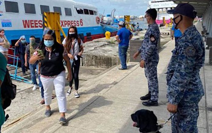 Passengers arrive at the Bredco port in Bacolod City on Oct. 31, 2020, the first day of the resumption of fastcraft trips in Western Visayas in about two months. PHILIPPINE COAST GUARD-NEGROS OCCIDENTAL