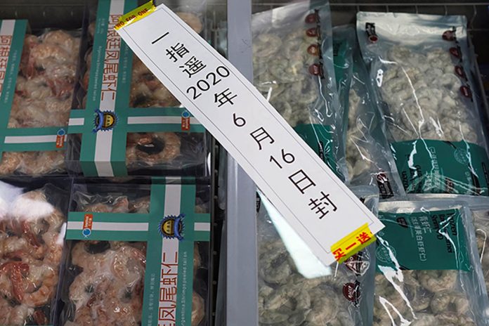 Frozen seafood products made of imported shrimps are seen inside a sealed freezer at a supermarket following a new outbreak of the coronavirus in Beijing, China. CARLOS GARCIA RAWLINS/REUTERS