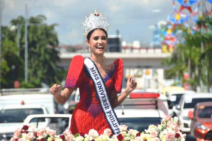 Draped in red Filipiniana, Miss Universe Philippines Rabiya Mateo is all smiles when she went around the streets of Iloilo City via a motorcade on Friday. MAYOR JERRY TREÑAS FB PAGE