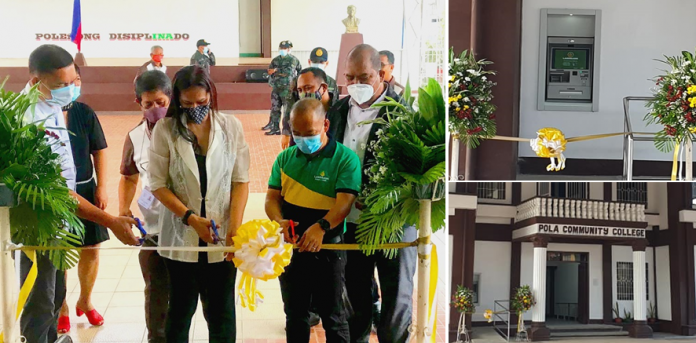 Pola Mayor Jennifer M. Cruz (second from left) and LANDBANK Pinamalayan Branch Head Ferdinand E. Abas (third from left) lead the ceremonial ribbon cutting during the inauguration of the first ATM in the Municipality of Pola. PHOTOS COURTESY OF LGU