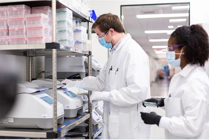 Researchers work in a lab run by Moderna Inc, who said Nov. 16, 2020 that its experimental vaccine was 94.5 percent effective in preventing COVID-19 based on interim data from a late-stage clinical trial. MODERNA INC, HANDOUT/REUTERS