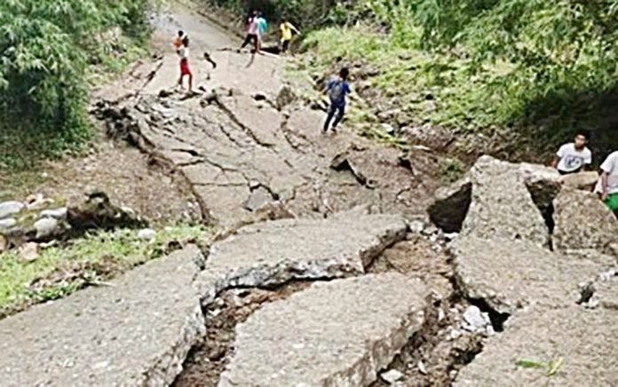 The concrete road in Barangay Dagami, Maasin, Iloilo cracked and sank considerably as loose soil and rocks beneath it collapsed during the onslaught of Typhoon Quinta in October. MAASIN MDRRMO LANDSLIDE