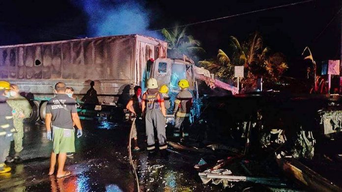 Fire fighters and emergency responders make sure the blaze is completely put out from this fire-stricken van in Purok Katilingban, Barangay Sagwa Banwa, Valladolid, Negros Occidental on Monday. MARK CABRILLO