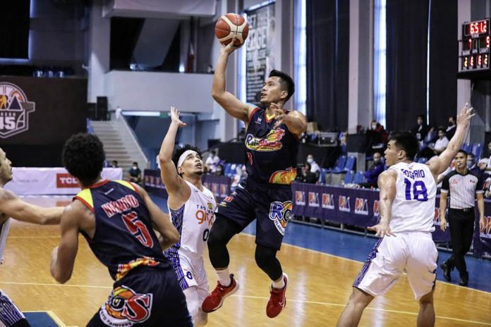 Rain or Shine Elasto Painters’ James Yap with a one-hander against the defense of TNT Tropang Giga’s Simon Enciso. PBA PHOTO