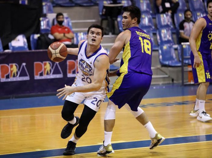 NLEX Road Warriors’ William McAloney eludes the defense of TNT Tropang Giga’s Jeth Troy Rosario as he tries for an inside hit during their 2020 PBA Philippine Cup match on Thursday night. PBA PHOTO