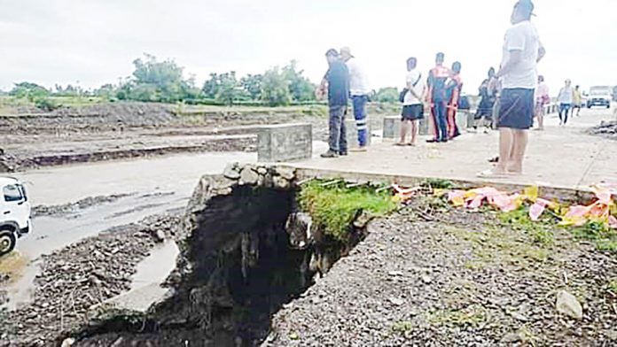 Antique Provincial Disaster Risk Reduction and Management Office head Broderick Train checks the dike in Barangay Camncijan, Culasi, Antique on Nov. 2, 2020. PDRRMO ANTIQUE