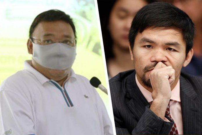 The Department of Interior and Local Government says it will conduct a “fact-finding” probe into the social gatherings recently attended by Presidential spokesperson Harry Roque (left) and Sen. Manny Pacquiao. ROQUE. PNA PHOTO (left); MANNY. MARK R. CRISTINO/EPA (right)