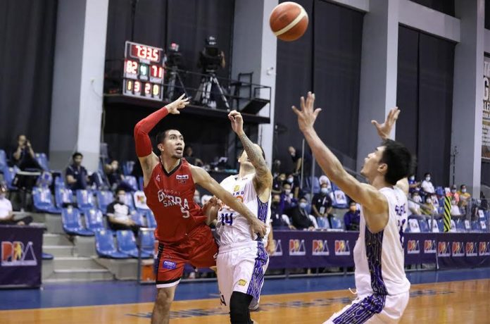 Barangay Ginebra San Miguel Kings’ LA Tenorio throws the ball after being bumped by TNT Tropang Giga’s David Semerad in Game 4 of their 2020 PBA Philippine Cup finals last Sunday. PBA PHOTO