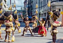 PRE-FILMED PERFORMANCE. Tribu Bariohanon “warriors” hit Iloilo City’s Mapa and Rizal streets Thursday afternoon during the shooting of their “pre-filmed” performance for Digital Dinagyang Festival 2021. This would be streamed on social media accessible to spectators the world over. IAN PAUL CORDERO/PN