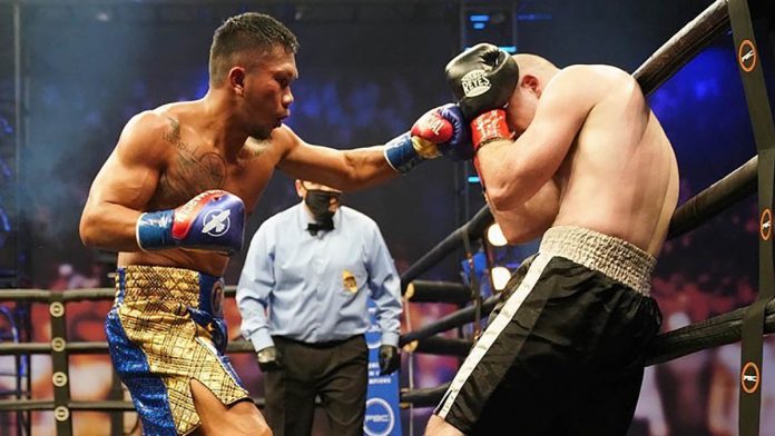 Filipino boxer Eumir Marcial lands a punch into the defense of American fighter Andrew Whitfield. EUMIR MARCIAL/FACEBOOOK