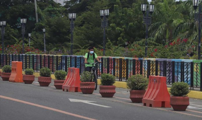 ARNOLD A cyclist takes a bike lane in Iloilo City. The Department of Health is mulling to exempt solo-riding cyclists from wearing face shields on top of masks in public places. ARNOLD ALMACEN/CMO