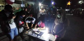 Antidrug operatives conduct an inventory of illegal drugs seized from Lovely Penicilla during an entrapment operation in Barangay Tanza Timawa Zone II, Iloilo City Monday night. IAN PAUL CORDERO/PN