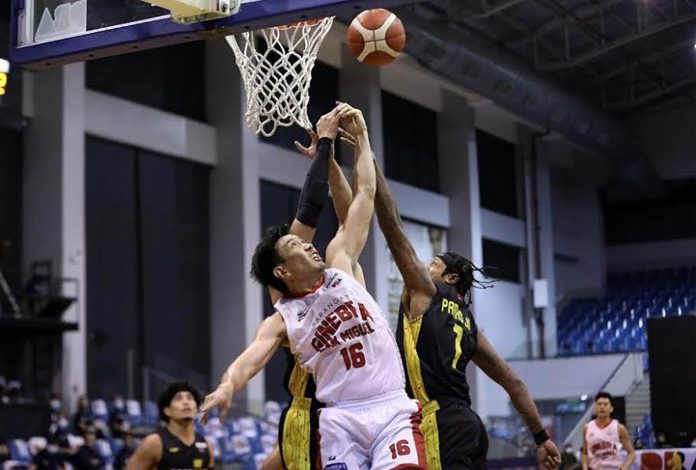 Bacolodnon Jeffrei Chan of Barangay Ginebra San Miguel Kings fights with TNT Tropang Giga players for a rebound in Game 1 of their 2020 PBA Philippine Cup finals last Sunday. PBA PHOTO