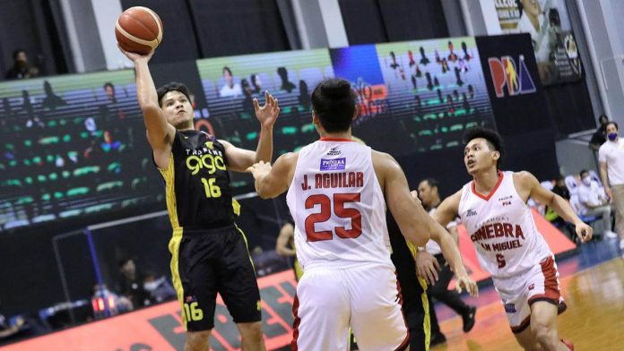 TNT Tropang Giga’s Roger Pogoy attempts a one-hander over Barangay Ginebra San Miguel Kings’ Japeth Aguilar. PBA PHOTO