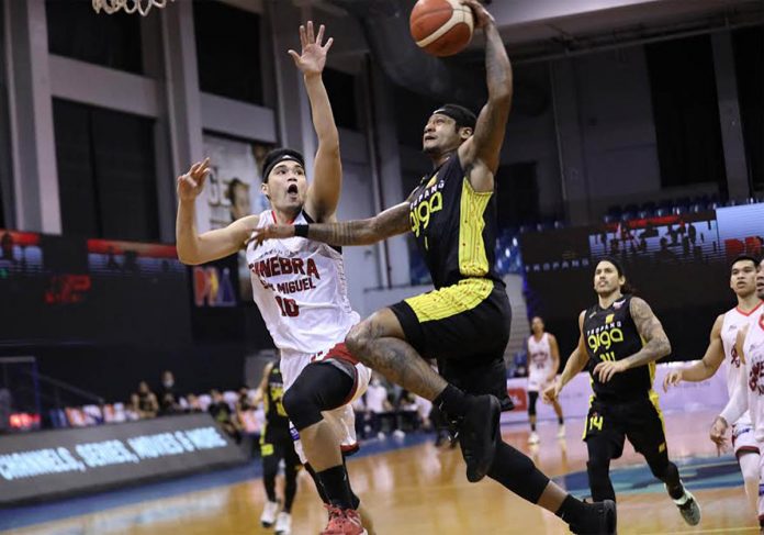 TNT Tropang Giga’s Bobby Ray Parks Jr. attempts to score against Barangay Ginebra San Miguel Kings’ Arvin Tolentino in Game 1 of their 2020 PBA Philippine Cup finals on Sunday night. PBA PHOTO