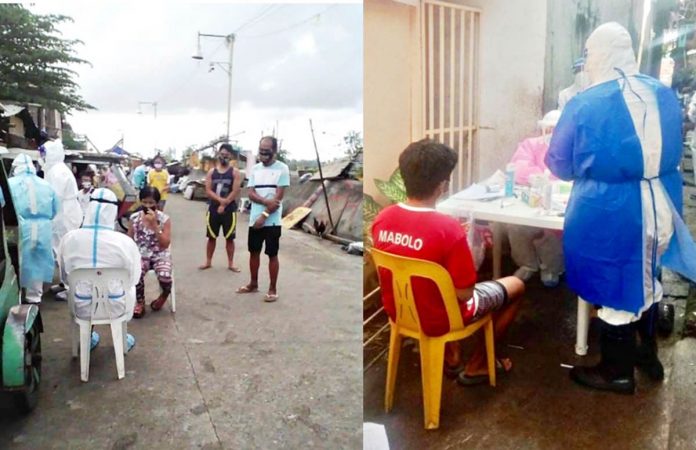 Residents of Purok 1 in Barangay Poblacion, Kalibo, Aklan get ready to be swabbed. Their specimens will be analyzed for coronavirus at the molecular laboratory of the Dr. Rafael S. Tumbokon Memorial Hospital in Kalibo and Western Visayas Medical Center sub-national laboratory in Iloilo City.