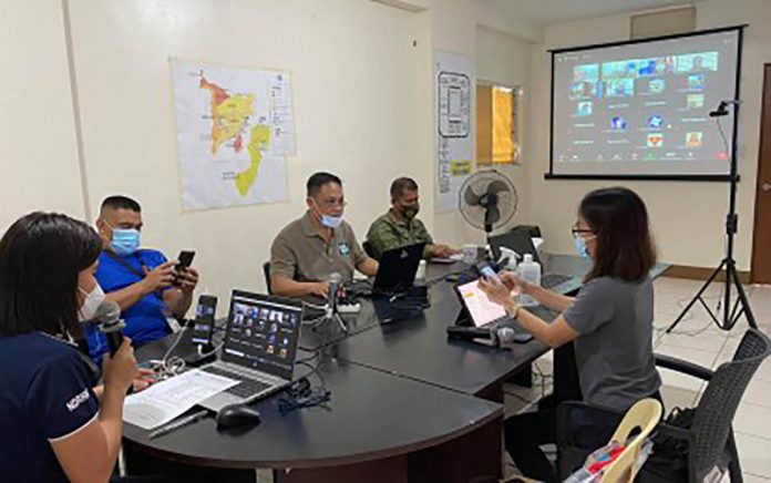 Members of the Regional Disaster Risk Reduction and Management Council convene on Dec. 18, 2020 for pre-disaster risk assessment in preparation for tropical depression “Vicky”. OCD-6 PHOTO/PNA