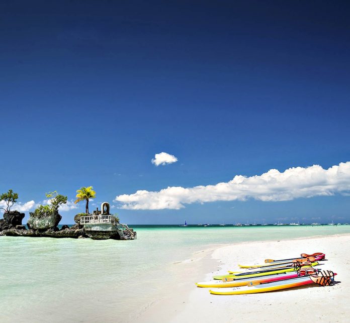 Through the years, Boracay Island gained popularity and became a top tourism destination, thereby ushering in developments such as hotels, restaurants, bars and rental houses. The increasing number of tourists, however, became unsustainable and breached the island’s carrying capacity. Photo shows Boracay’s famous landmark, Willy’s Rock. DOT Photo