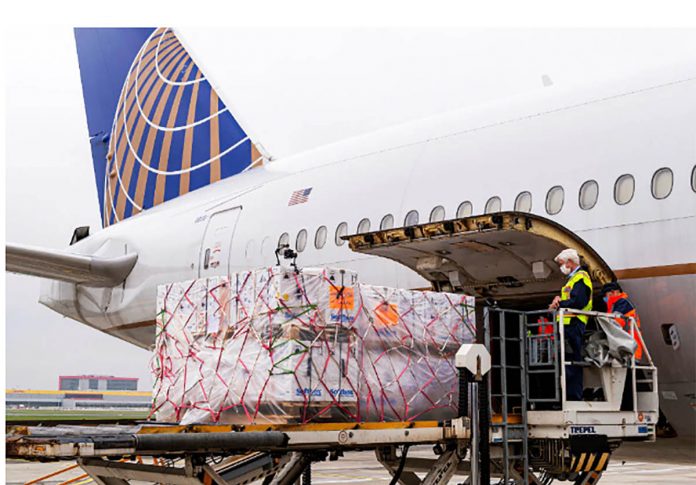 A shipment of Pfizer’s COVID-19 vaccines is unloaded from a United Airlines cargo-only flight from Brussels to O’Hare International Airport in Chicago, Illinois, United States on Dec. 2, 2020. UNITED AIRLINES/HANDOUT VIA REUTERS