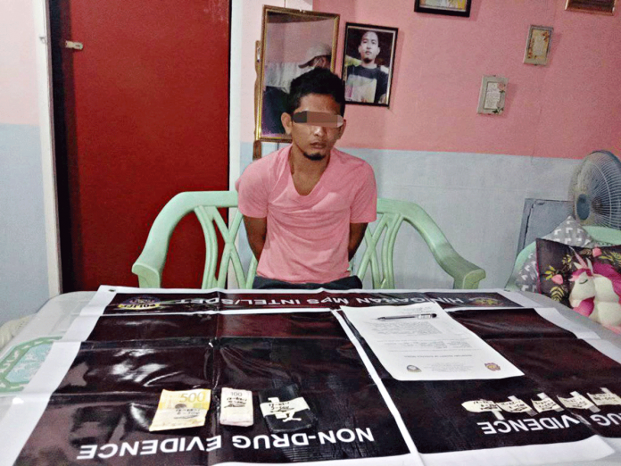 BUSTED. Abnell Suanque yielded these suspected shabu and marked money during an entrapment operation in in Barangay 1 Poblacion, Hinigaran, Negros Occidental on Jan. 27. RADIO NATIN HINIGARAN