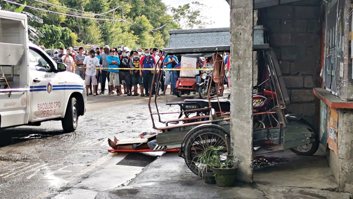 Authorities cordon this area in Barangay Pahanocoy, Bacolod City where tricycle driver Noel Peraren was shot dead by motorcycle-riding assassins early morning yesterday. BCPO