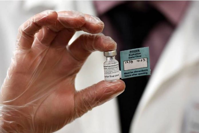 A vial of the Pfizer vaccine against COVID-19 used at The Reservoir nursing facility is shown in West Hartford, Connecticut, United States on Dec. 18, 2020. STEPHEN DUNN/POOL VIA REUTERS