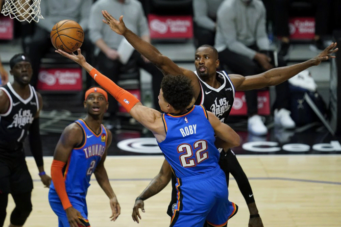 Oklahoma City Thunder forward Isaiah Roby takes a shot against center Serge Ibaka during the third quarter of an NBA basketball game on Jan. 24 in Los Angeles, California, United States. AP PHOTO