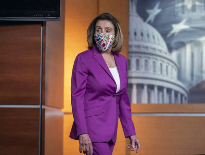 Speaker of the House Nancy Pelosi, D-Calif., holds a news conference on the day after violent protesters loyal to President Donald Trump stormed the US Congress, at the Capitol in Washington on Jan. 7, 2021. J. SCOTT APPLEWHITE/AP PHOTO