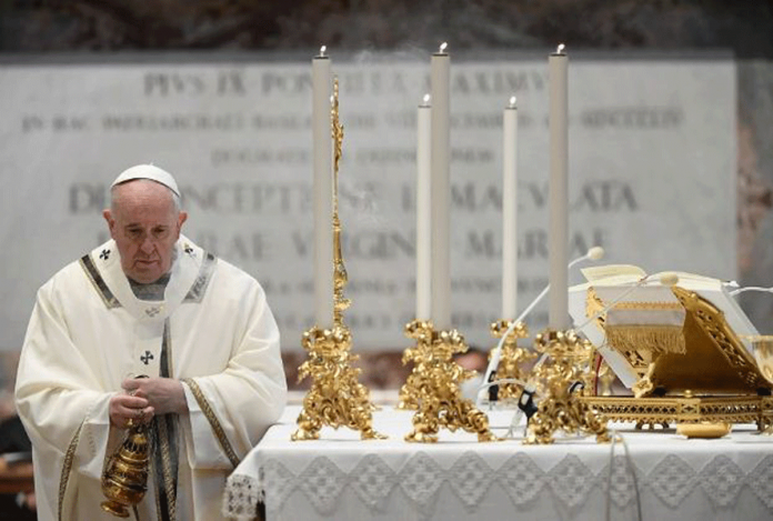 Pope Francis conducts a Mass for the Feast of Epiphany in St. Peter’s Basilica at the Vatican on Jan. 6, 2021. VATICAN MEDIA/HANDOUT VIA REUTERS/FILE