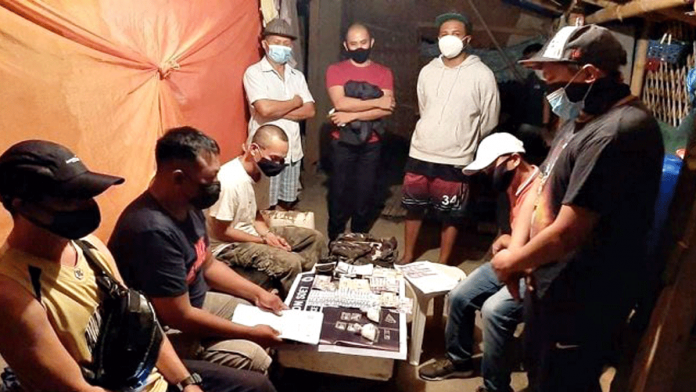 Antidrug oepratives conduct an inventory of suspected shabu seized from Elmer Niquia in a buy-bust operation in Barangay Alalasan, La Paz, Iloilo City Thursday. IPPO