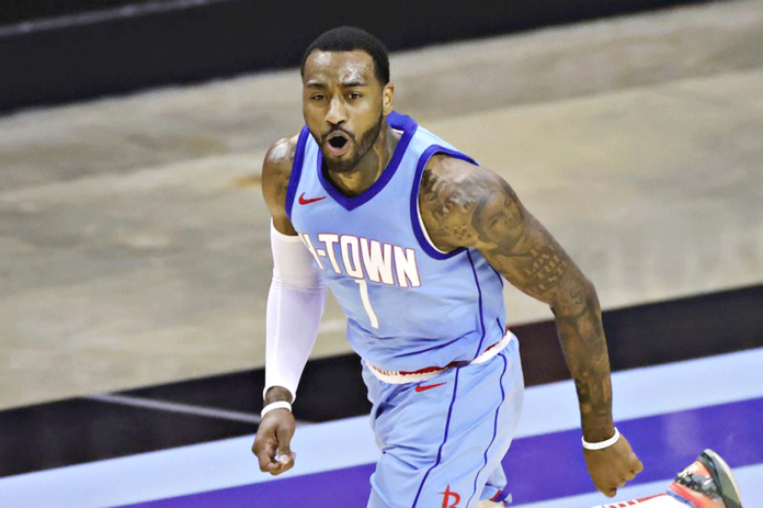 Houston Rockets' John Wall reacts during the second quarter against the Washington Wizards in an NBA basketball game Tuesday, Jan. 26, 2021, in Houston. CARMEN MANDATO/POOL PHOTO VIA AP