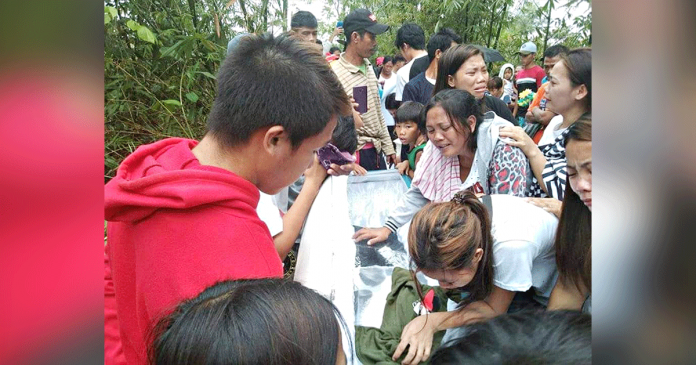 LAID TO REST. Cries of grief punctuate the funeral ceremony of three slain tumandok members Sunday morning in Tapaz, Capiz. Their families and relatives bid an emotional farewell weeks after the fatal military-police operations. SANDUGO-MOVEMENT OF MORO AND INDIGENOUS PEOPLES