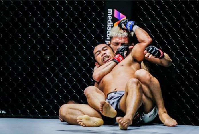 Ilonggo mixed martial arts fighter Robin Catalan is being choked by Japanese Ryuto Sawada during the One: Unbreakable 3 Fight on Feb. 5 at Singapore Indoor Stadium. ONE PHOTO