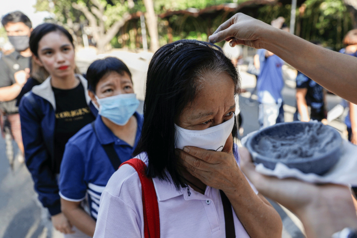 NO TOUCH. A priest sprinkles blessed ash on the heads of the faithful during Ash Wednesday rites. Ash Wednesday comes from the ancient Jewish tradition of penance and fasting. The practice includes the wearing of ashes on the head. The ashes symbolize the dust from which God made man. ELOISA LOPEZ/REUTERS