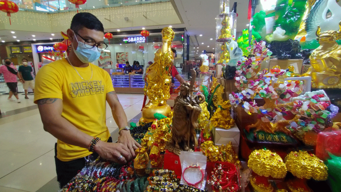 Feng Shui stall vendor Melvin Aranda says people patronize good luck items believing they will bring prosperity and fortune. GLENDA TAYONA/PN